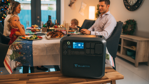 family members celebrate christmas with solar-powered generator